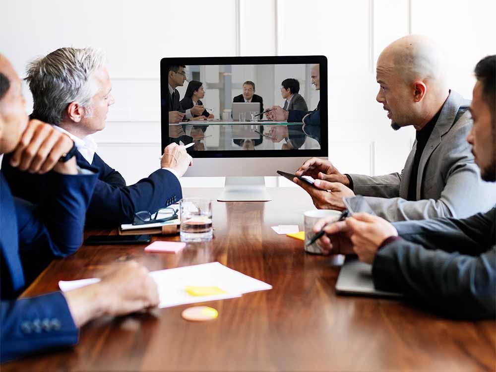 Attorneys using videoconferencing for a remote deposition